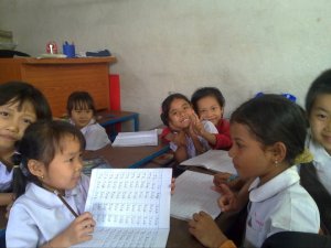 Spelling class with girls at Hsa Htaw Learning Centre